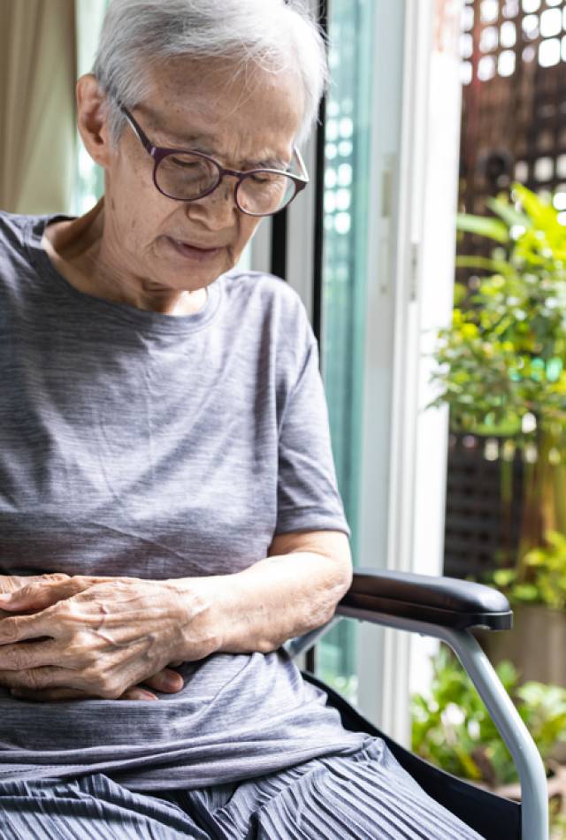 Asian,Senior,Woman,With,Abdominal,Pain,On,Right,Side,Of