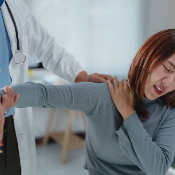 Female,Patient,Experiencing,Shoulder,Pain,During,A,Physical,Examination,Conducted