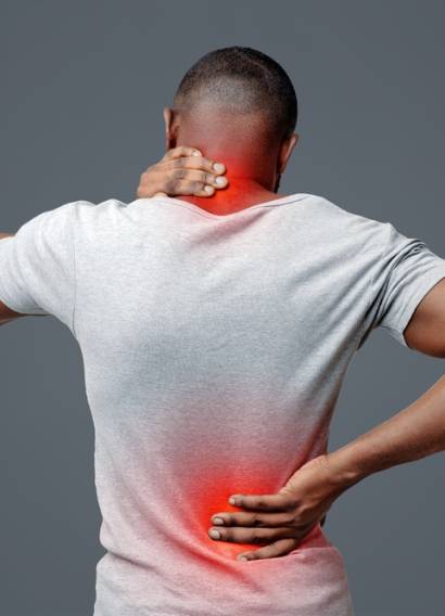 African,Man,With,Neck,And,Back,Pain,,Rubbing,His,Painful